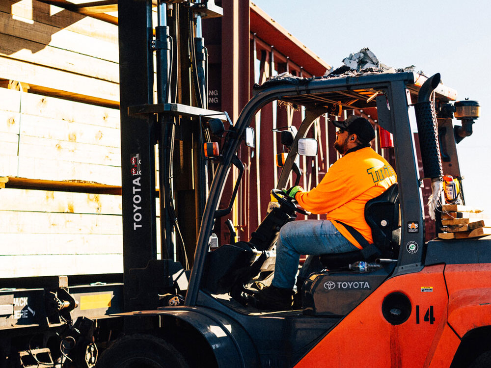 Trio forklift operator